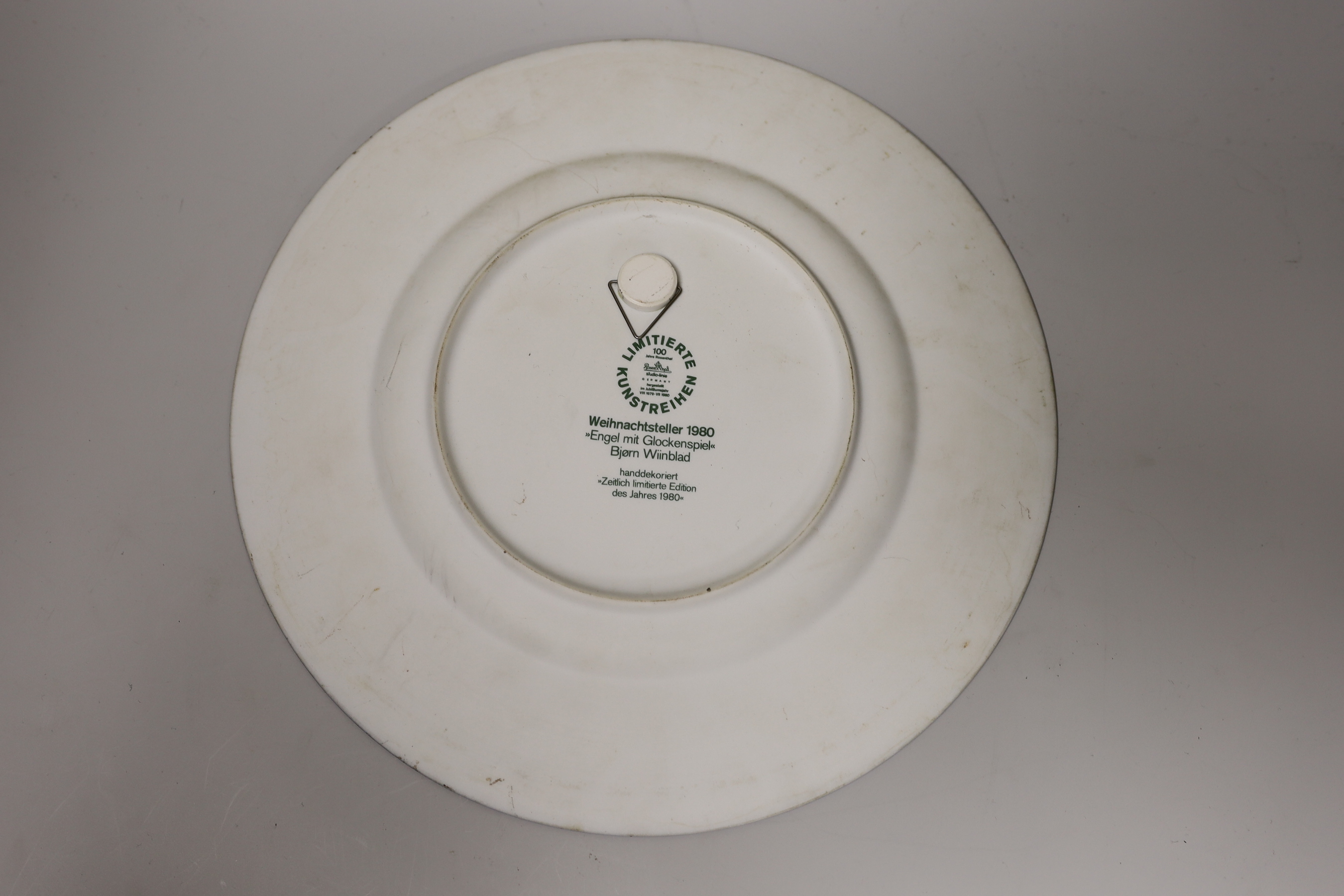A Cauldon plate painted with blue tits on toadstools and a butterfly on another, signed R. Barratt, Derby, made for Burley & Co. Chicago, a Rosenthal limited edition plate Weihnachtsteller 1980, and an art pottery dish